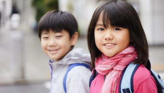 Two school kids in the street