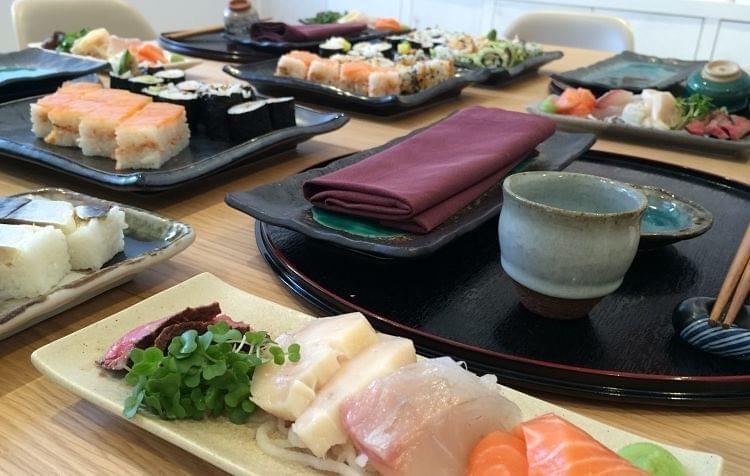 Some plates with Hashi sushi on a table ready to eat