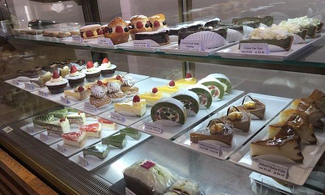 Some Japanese patisserie in a display cabinet in a cafe