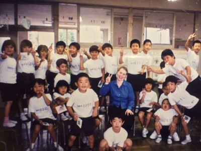 A group of Japanese schoolchildren with their English teacher