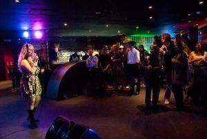 A group of people in a karaoke bar