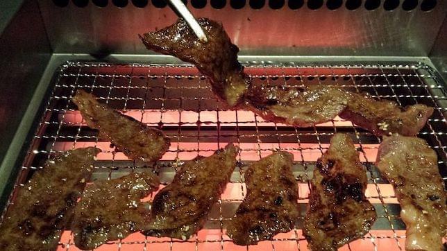 Some Japanese style BBQ meat on a grill