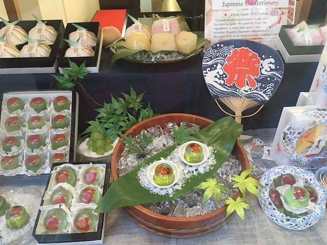 Some Japanese sweets on display in a window