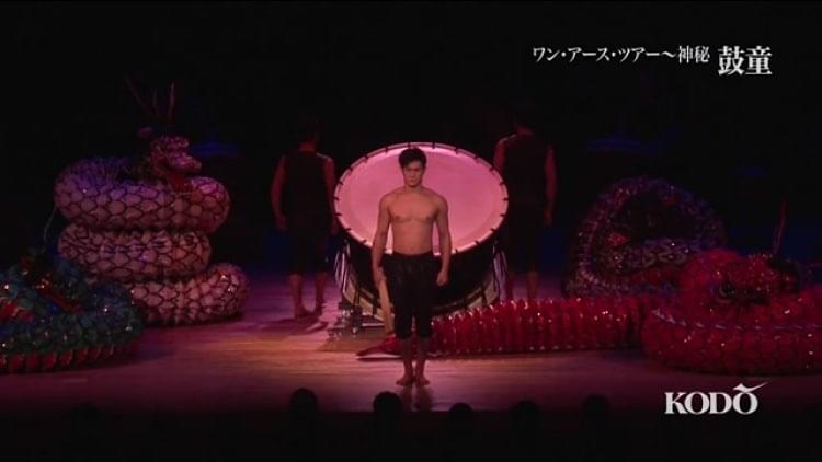 A Japanese man performing on a stage