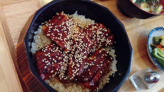 Some Japanese eel in a wooden bowl