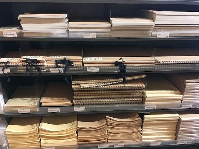 Notebooks and stationery on a shelf in a shop