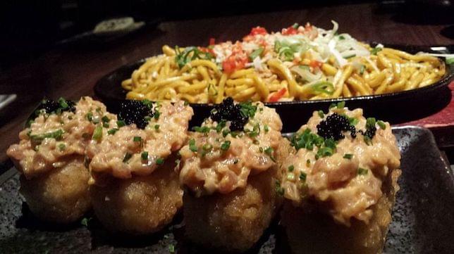 A Japanese rice and noodle dish on a plate