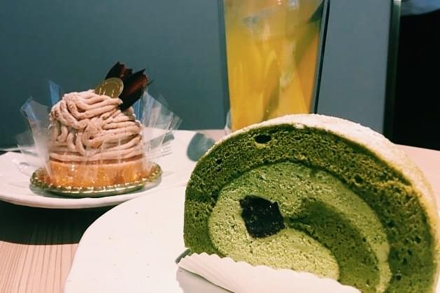A matcha roll on a plate, which is sitting on a table