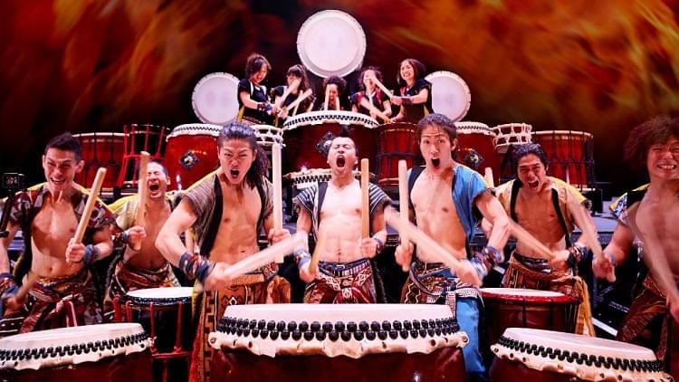 Taiko drummers performing on stage