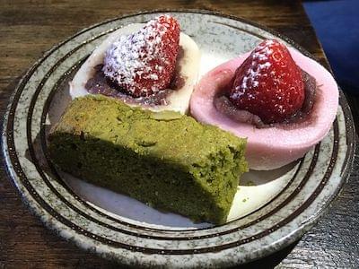 Various kinds of cakes with strawberries on top