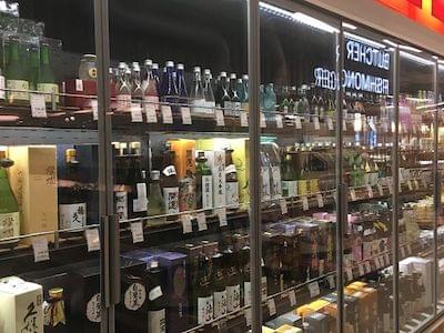 Many bottles of alcohol on shelves